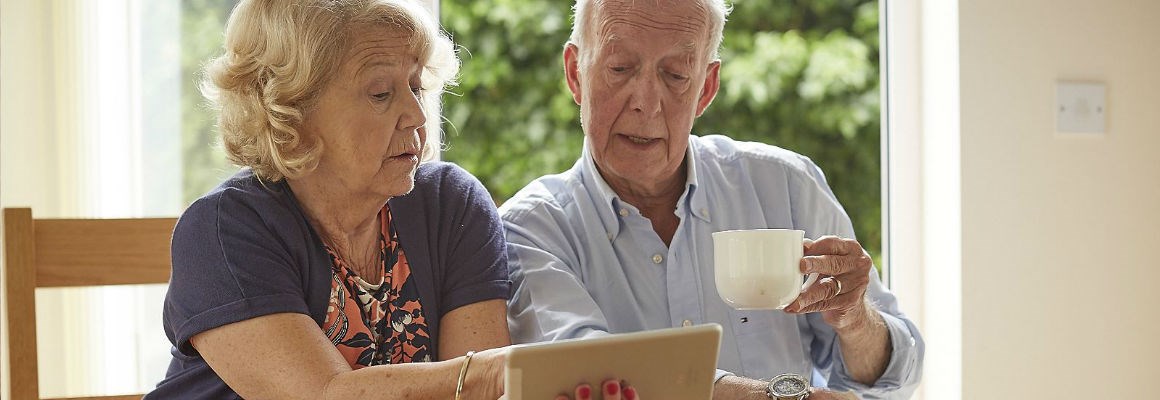older couple looking at tablet computer
